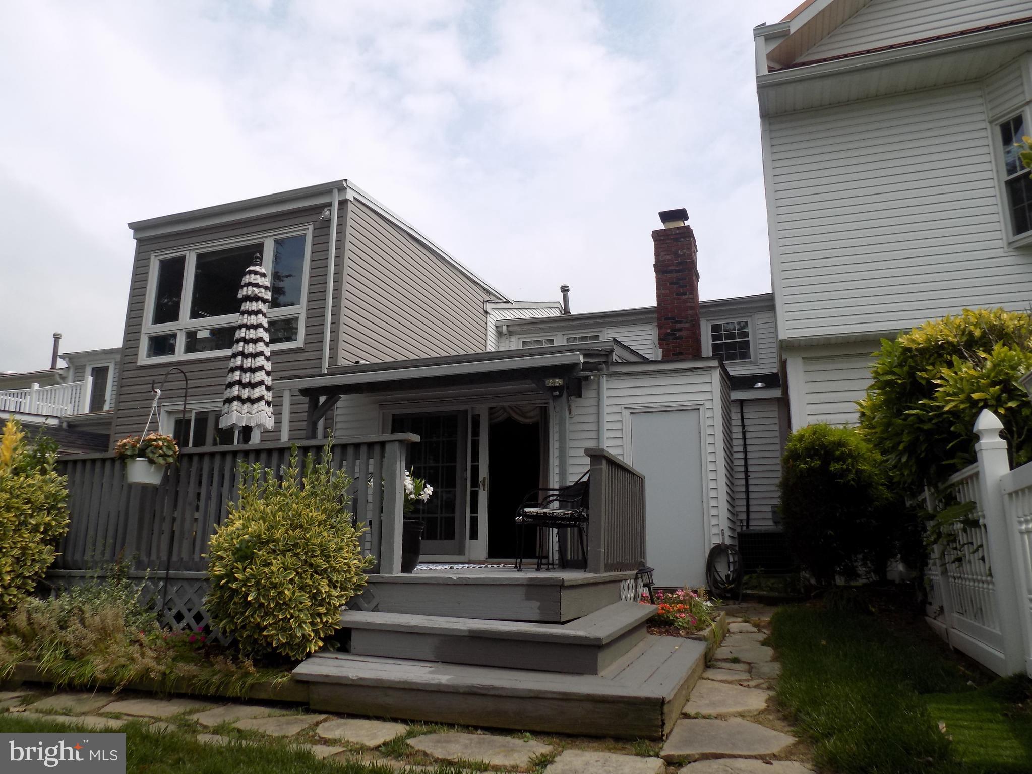 702 Towne Center Drive Joppa, MD 21085 - Photo 29 of 45 a front view of a house with a garden