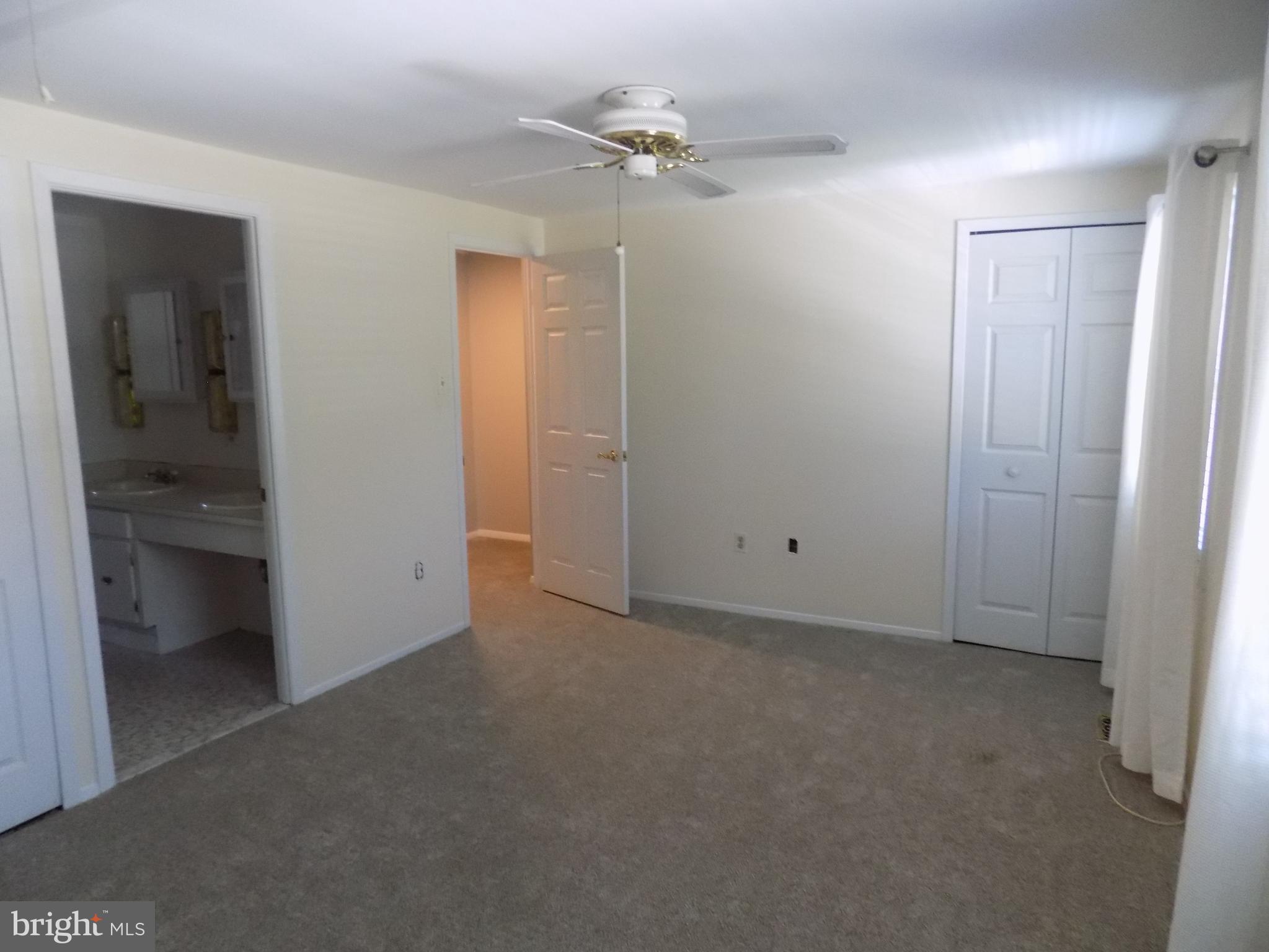 702 Towne Center Drive Joppa, MD 21085 - Photo 33 of 45 an empty room with a bathroom