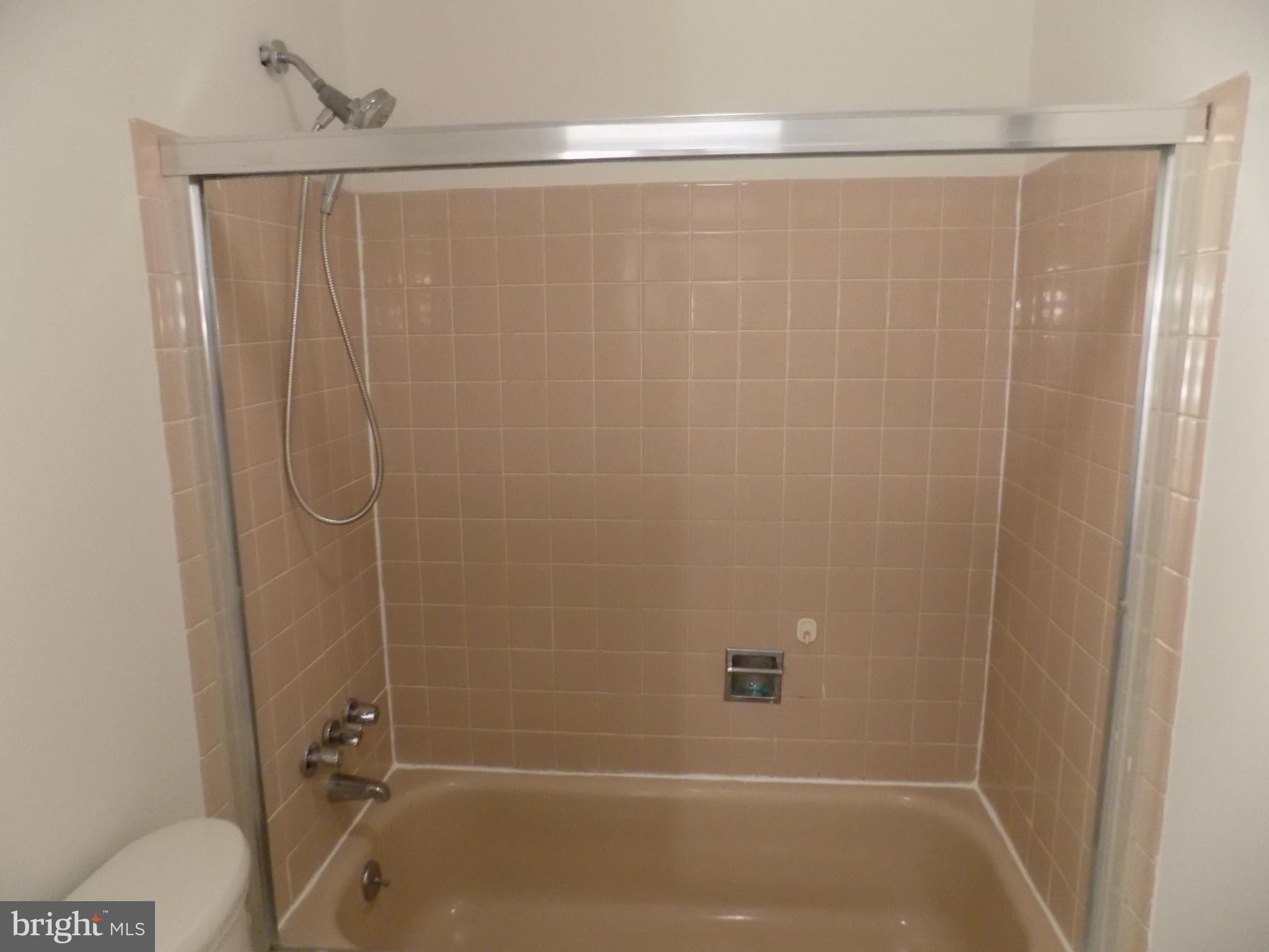 702 Towne Center Drive Joppa, MD 21085 - Photo 39 of 45 a bathroom with a shower and a sink