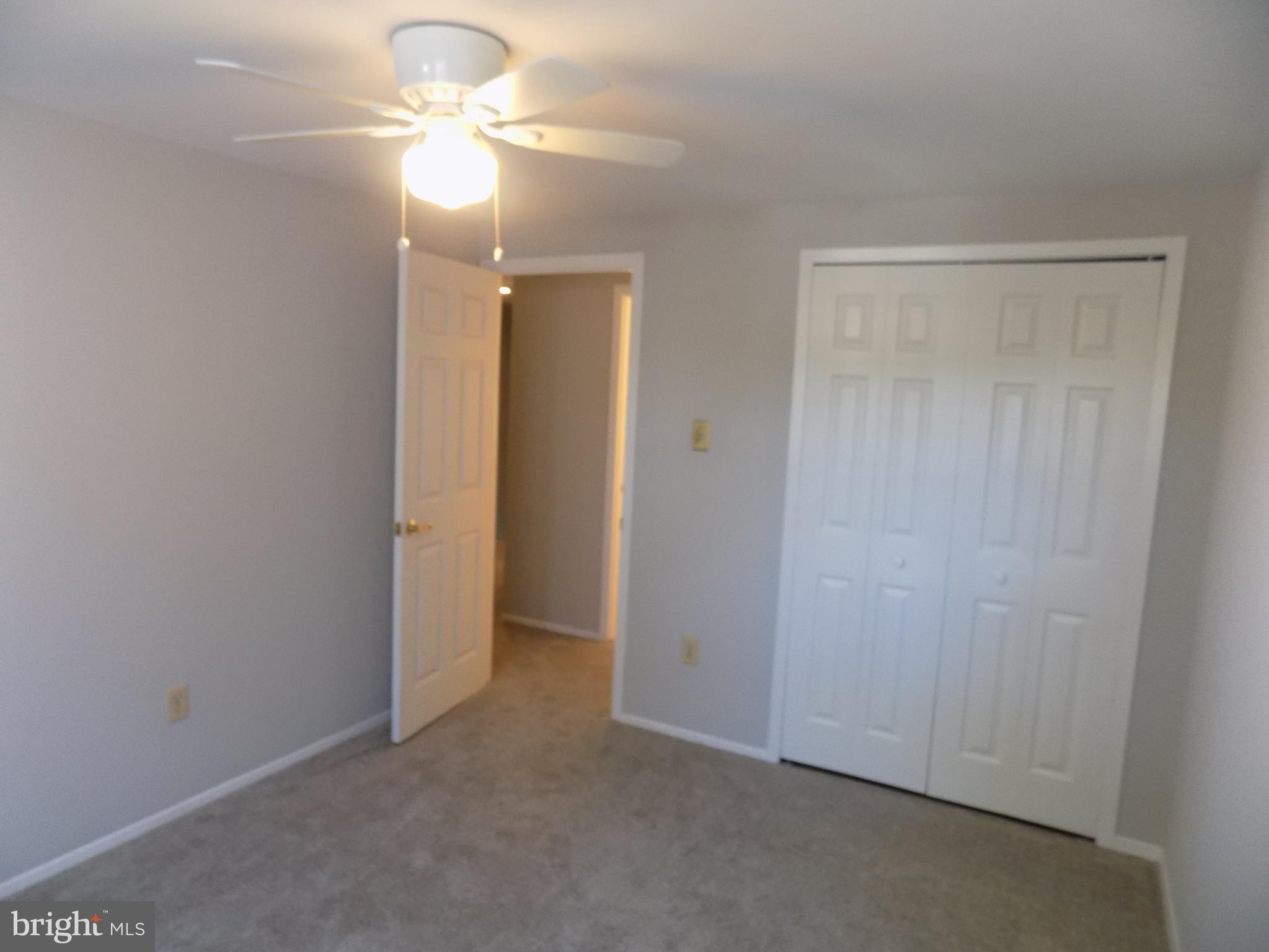 702 Towne Center Drive Joppa, MD 21085 - Photo 43 of 45 a view of a chandelier fan in a room