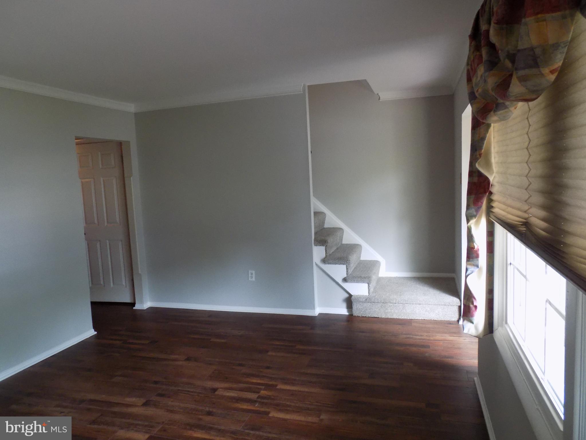 702 Towne Center Drive Joppa, MD 21085 - Photo 5 of 45 a view of entryway with wooden floor