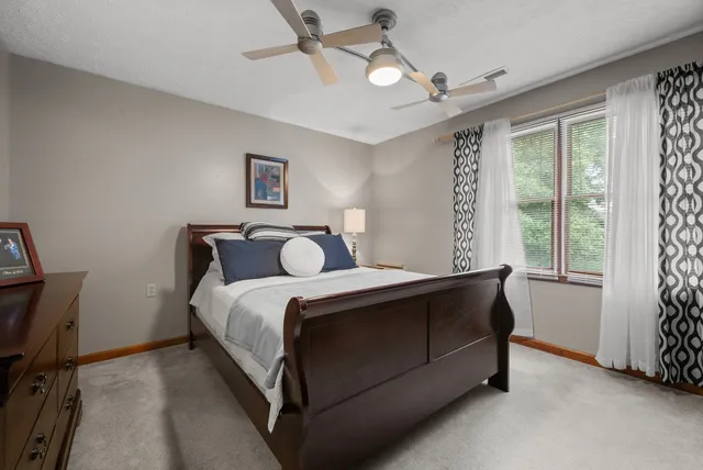 a view of a patio with couches chairs potted plants and ocean view