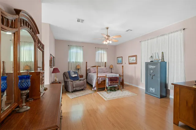 a bed room with a bed and a chandelier