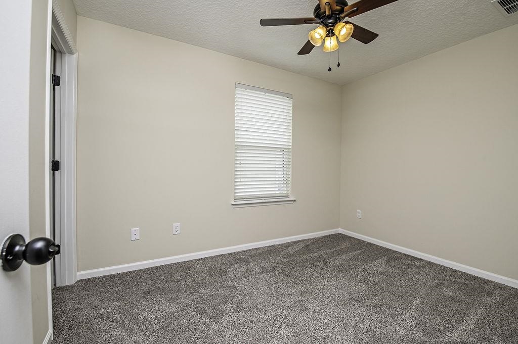 41 Nelson Lane St. Johns, FL 32259 - Photo 22 of 34 an empty room with a window and a fan
