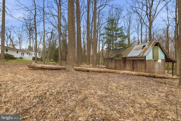 a view of a house with basketball court