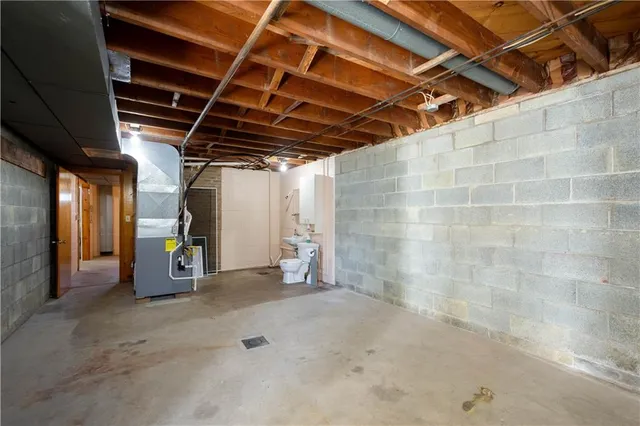 a view of a refrigerator and an empty room