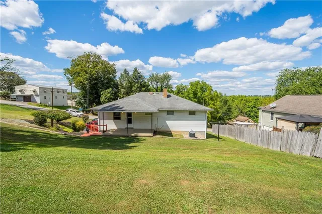a view of a house with a big yard