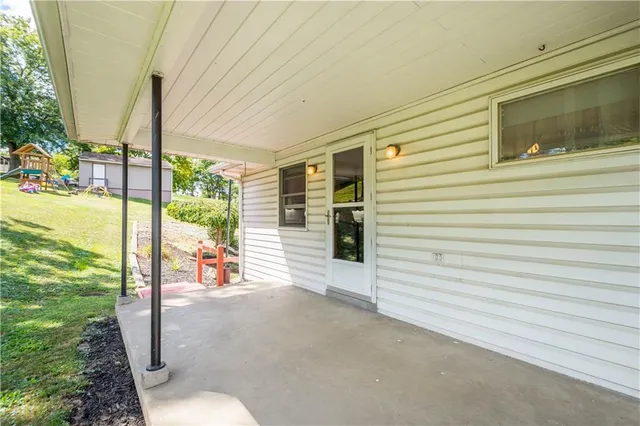a view of a porch with furniture