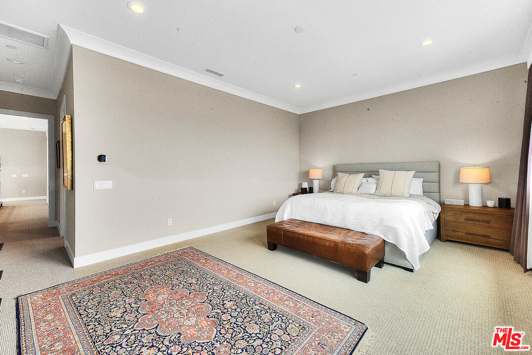20558 Overlook Court Porter Ranch, CA 91326 - Photo 21 of 48 a bedroom with a bed and a rug