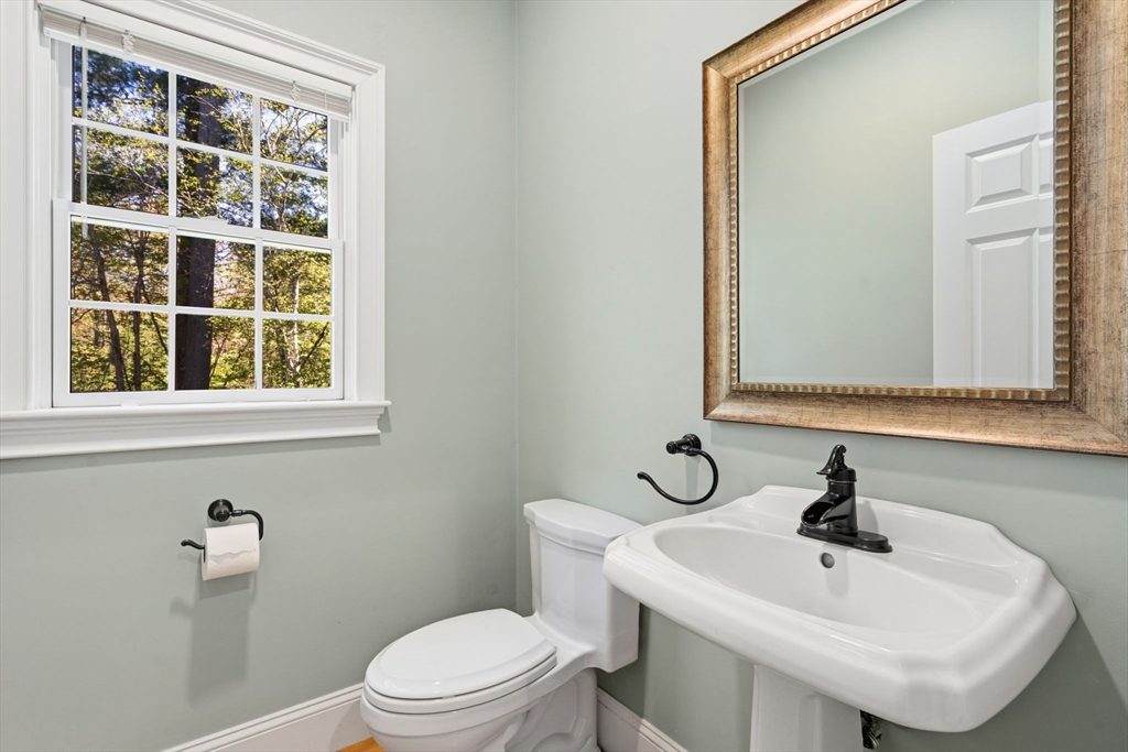 220 Newtown Road Acton, MA 01720 - Photo 13 of 39 a bathroom with a sink a toilet and a mirror