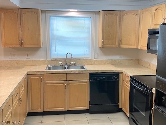 105 Texas Road Lehigh Acres, FL 33936 - Photo 2 of 11 a kitchen with stainless steel appliances granite countertop a stove a sink and a microwave