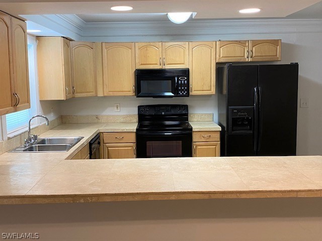 105 Texas Road Lehigh Acres, FL 33936 - Photo 3 of 11 a kitchen with a refrigerator and a sink