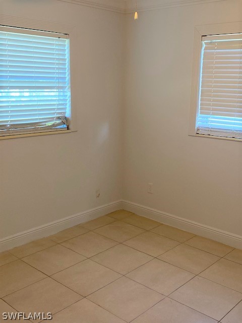 105 Texas Road Lehigh Acres, FL 33936 - Photo 8 of 11 an empty room with a window