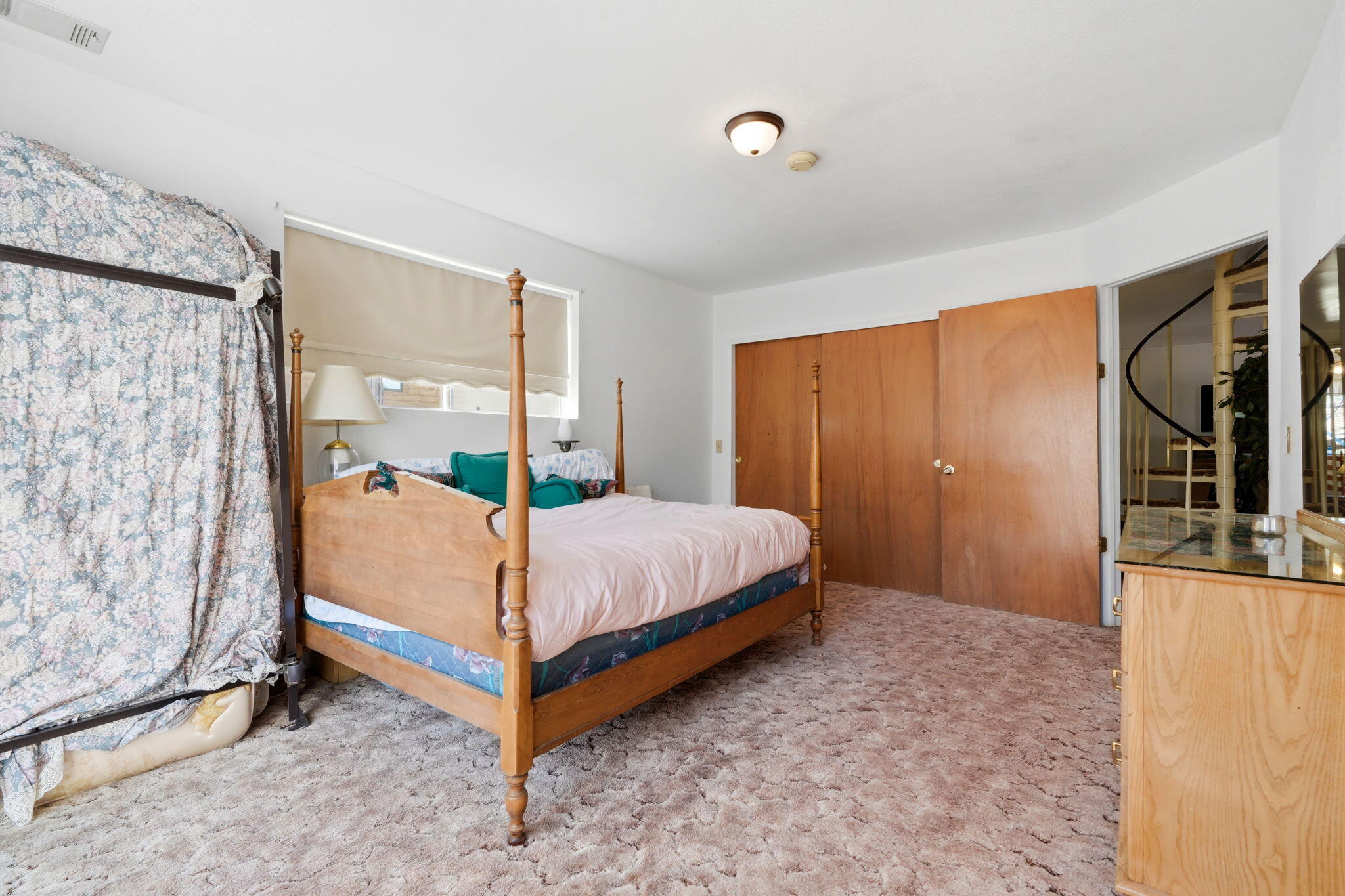 697 Loop Drive Springville, CA 93265 - Photo 26 of 55 a bed sitting in a spacious bedroom next to a window