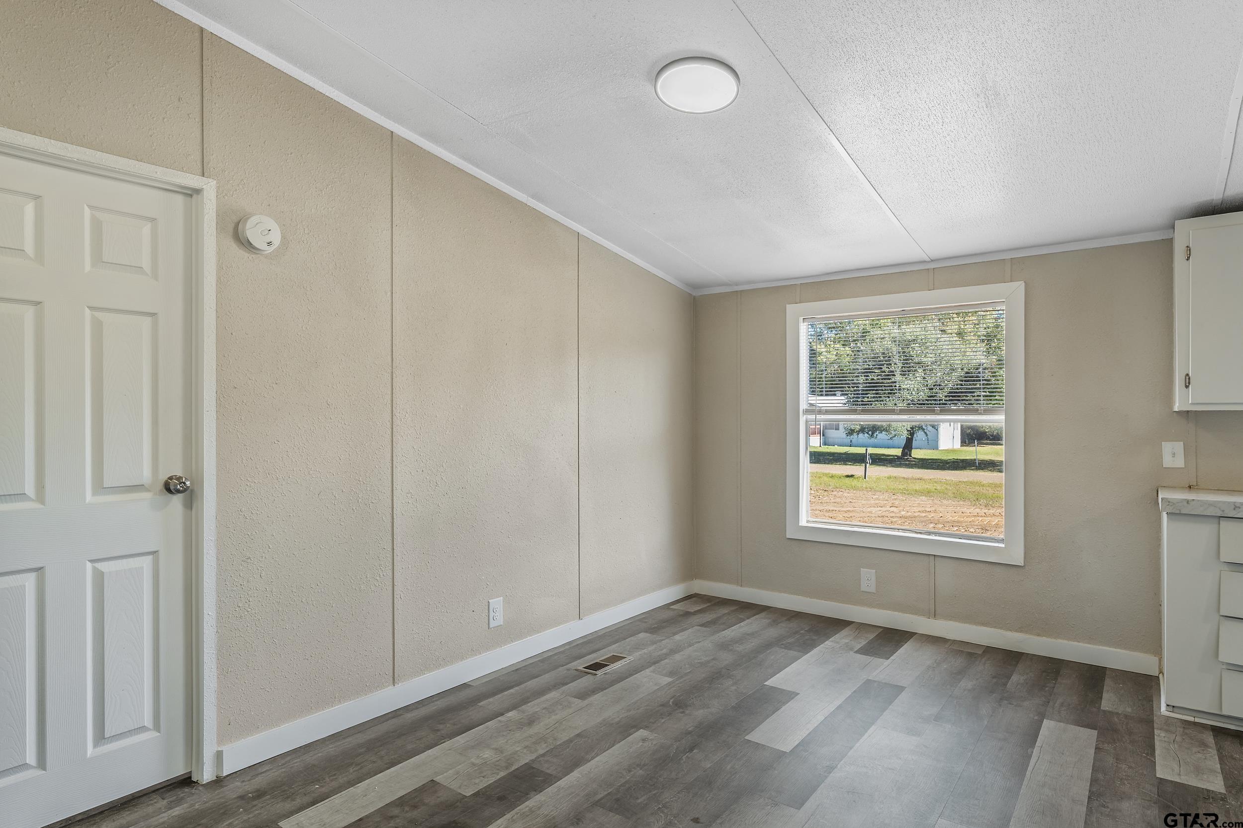 1121 Pecan Ridge Chandler, TX 75758 - Photo 16 of 26 a view of an empty room and window