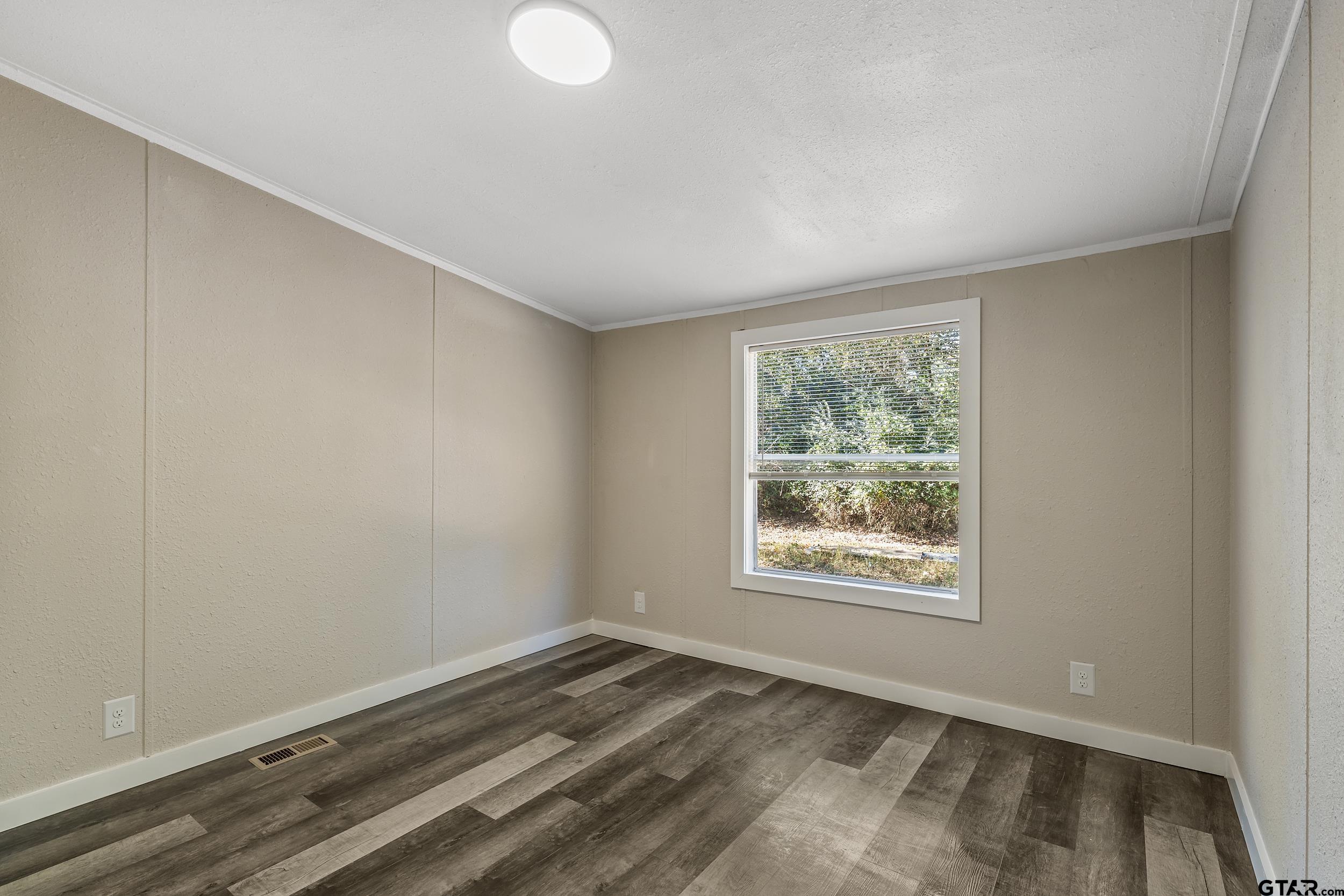 1121 Pecan Ridge Chandler, TX 75758 - Photo 17 of 26 a view of empty room with window