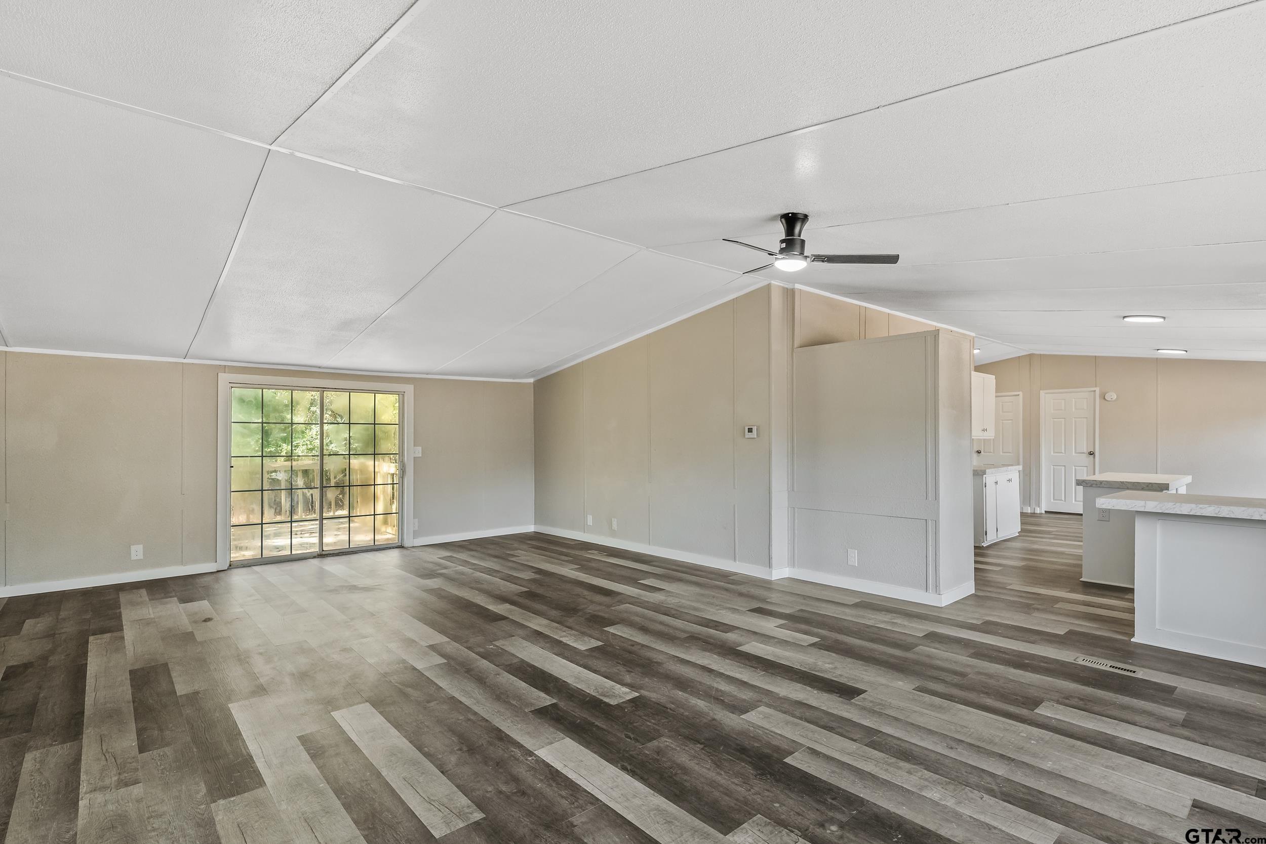 1121 Pecan Ridge Chandler, TX 75758 - Photo 5 of 26 a view of an empty room with a window