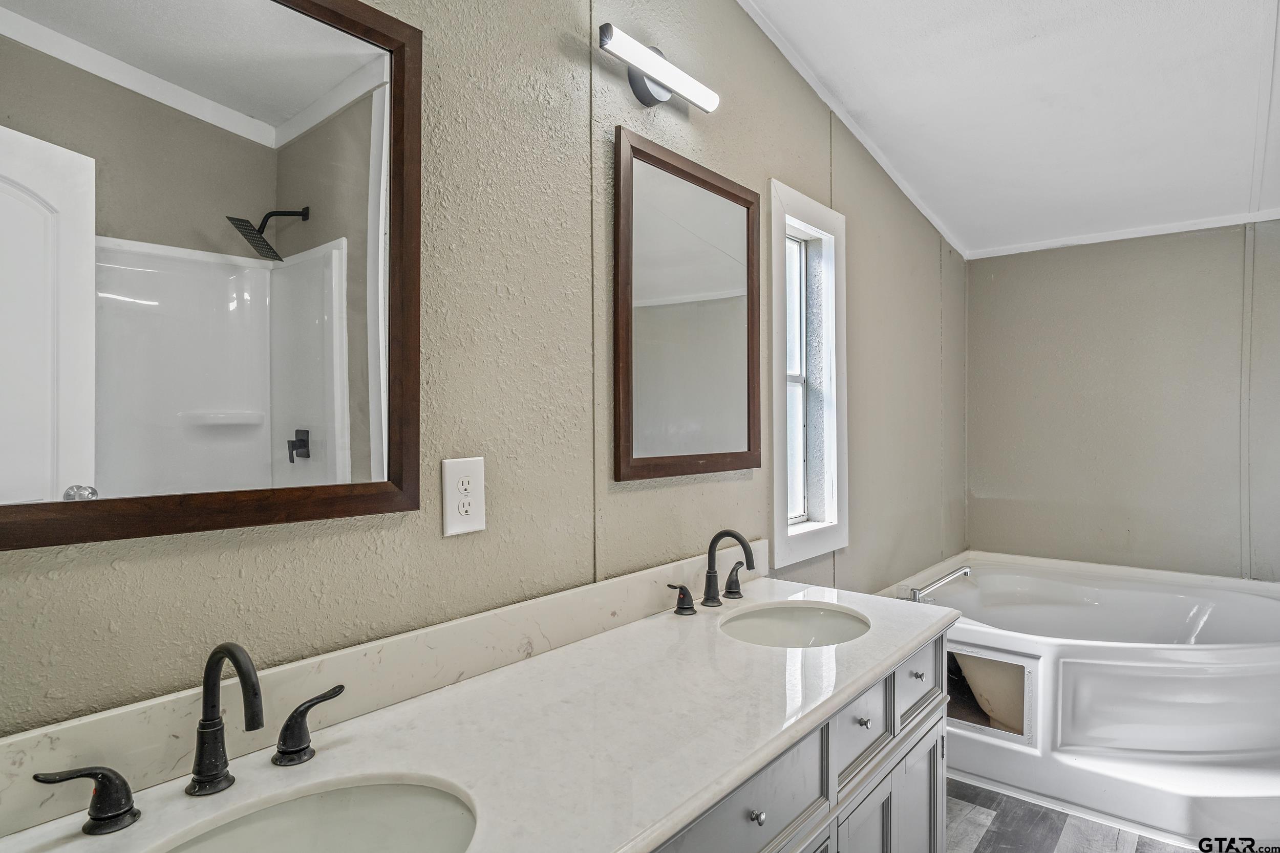1121 Pecan Ridge Chandler, TX 75758 - Photo 9 of 26 a bathroom with a granite countertop sink and a mirror
