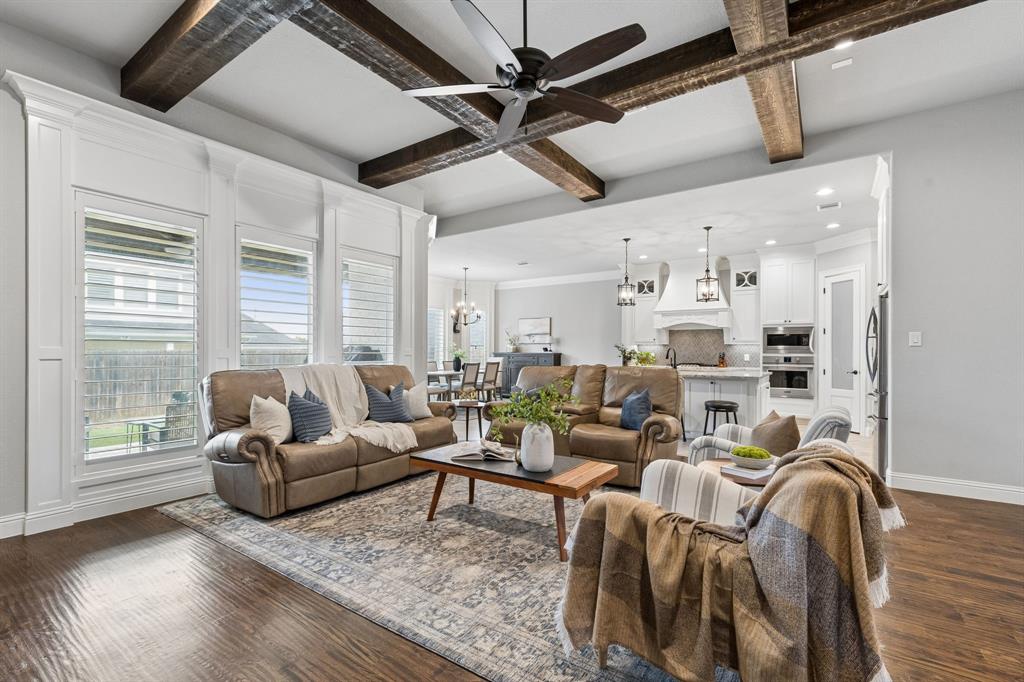 104 Ryder Court Hurst, TX 76053 - Photo 10 of 35 Spacious Open-Concept Living Room with Large Windows and Backyard Views