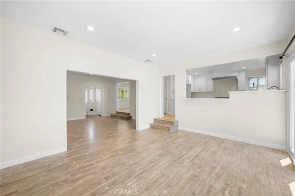 a view of a livingroom with wooden floor