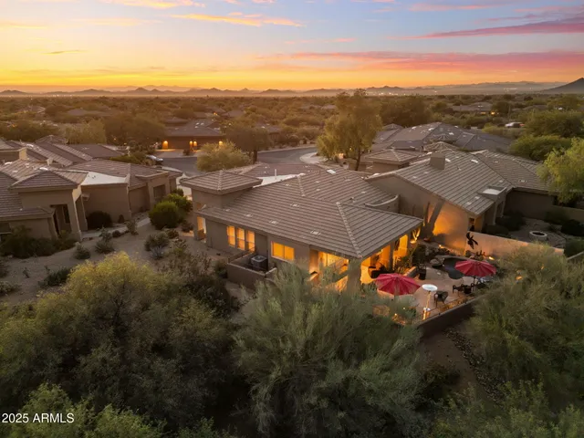 a view of a town with mountains in the background