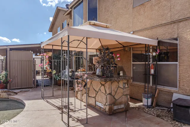a view of walk in closet with clothes
