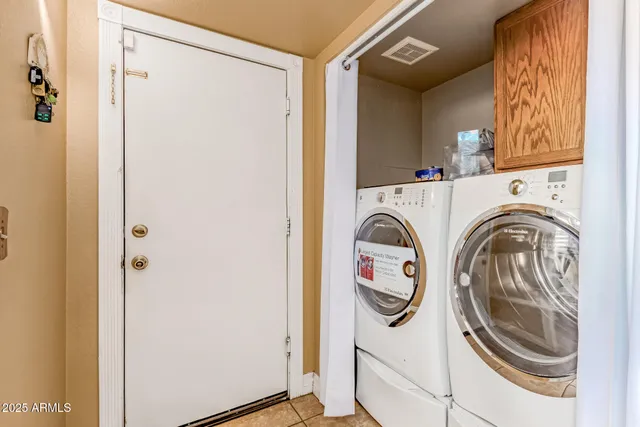 a room with a dresser and a window