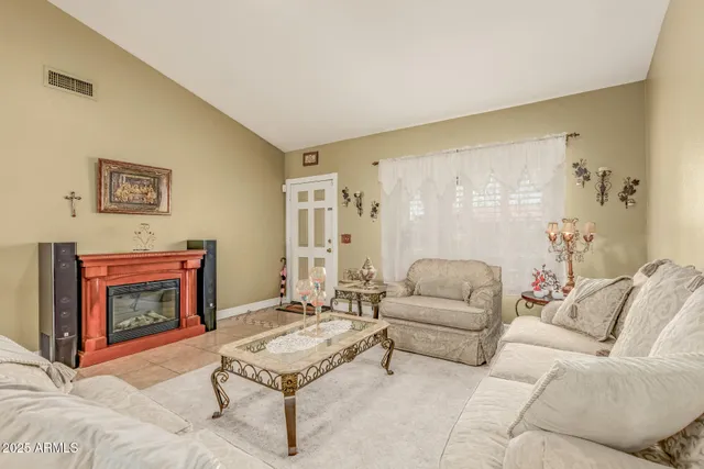 a view of a house with a yard and plants