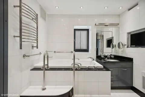 a kitchen with granite countertop a sink and a stove top oven