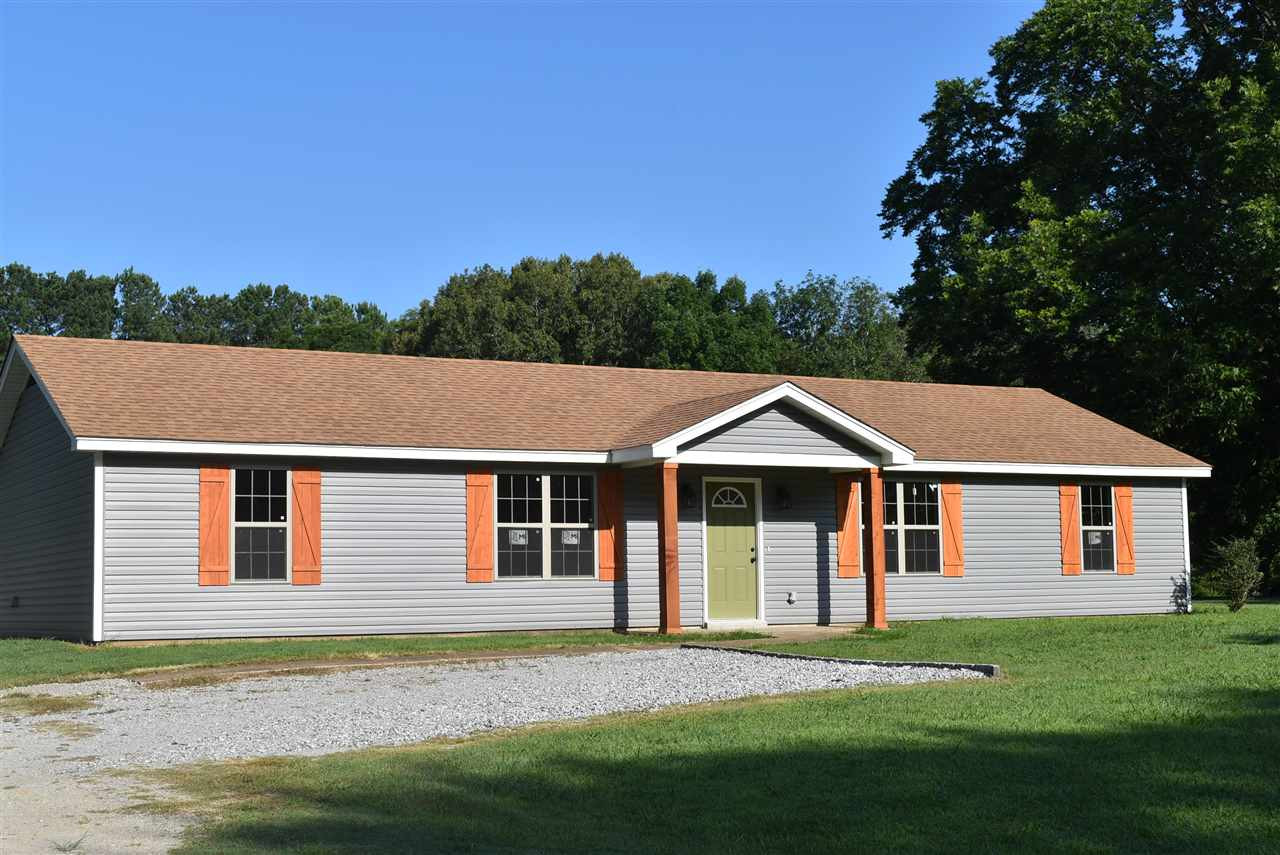 207 Fitzgerald Road Jackson, TN 38301 - Photo 1 of 1 a front view of a house with a garden