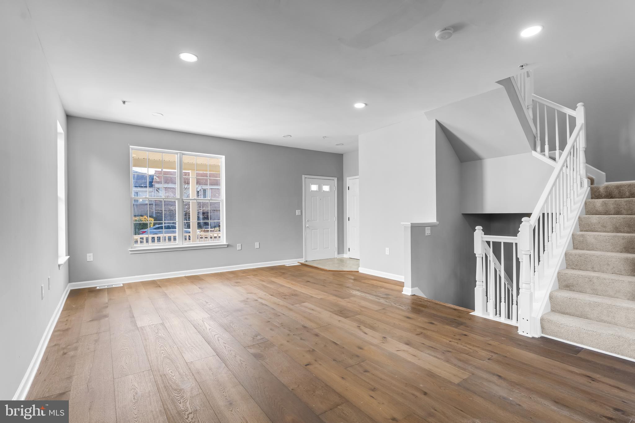 149 58th Street Southeast Washington, DC 20019 - Photo 22 of 32 a view of an empty room with wooden floor and a window