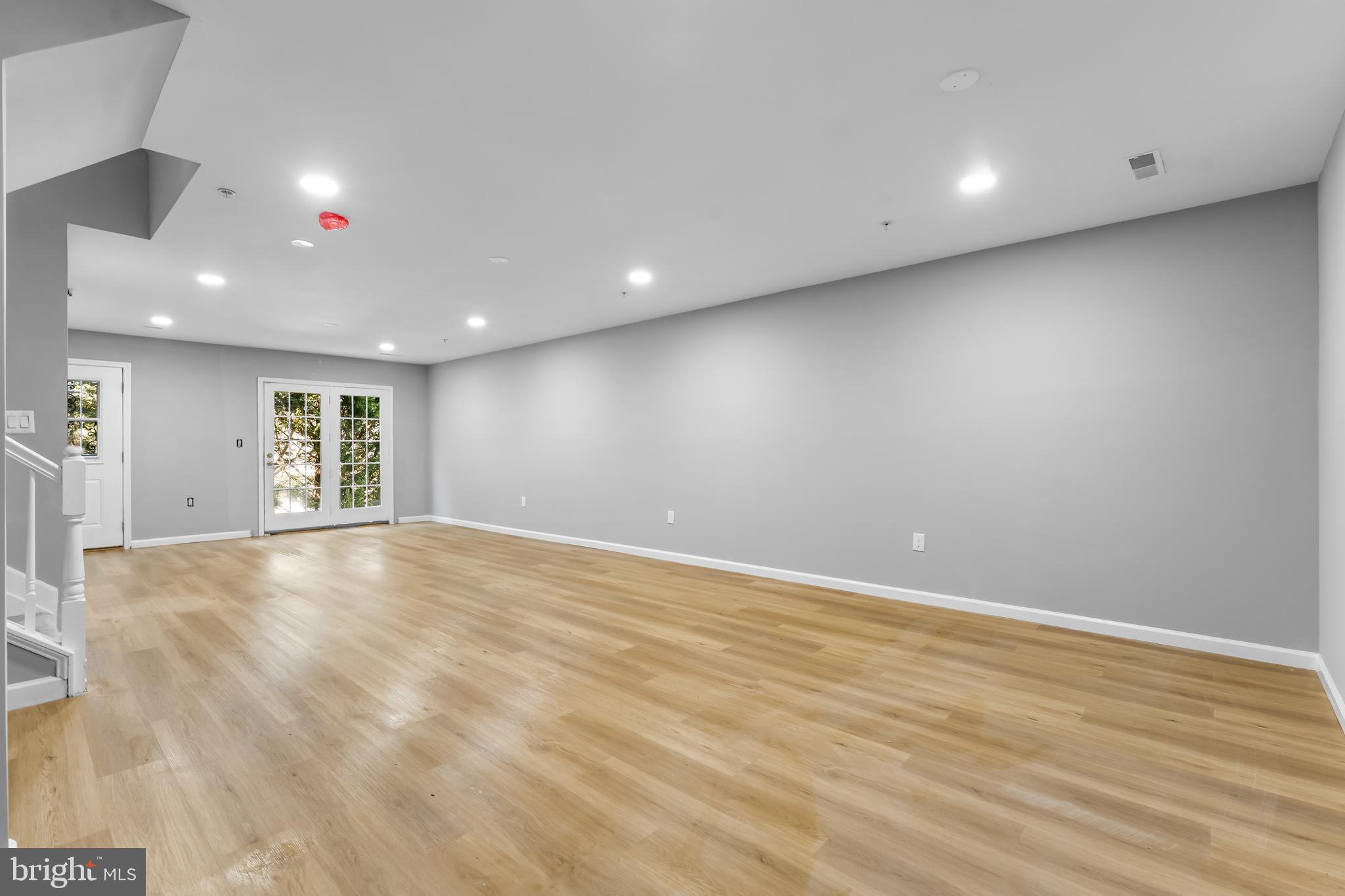 149 58th Street Southeast Washington, DC 20019 - Photo 32 of 32 an empty room with wooden floor and windows