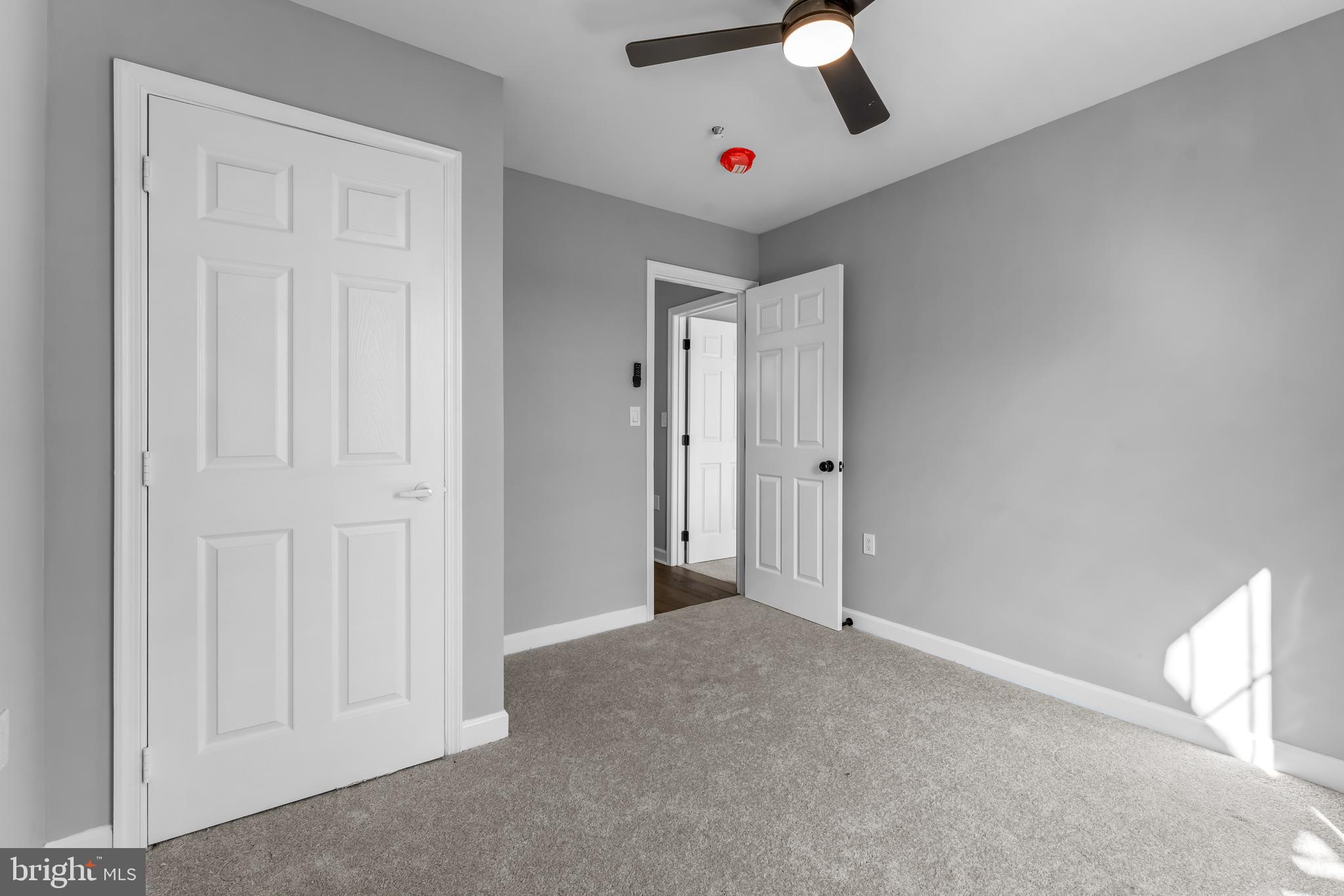 149 58th Street Southeast Washington, DC 20019 - Photo 6 of 32 an empty room with projector and fan