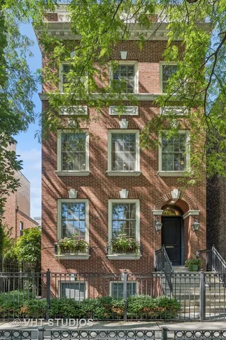 an aerial view of a residential apartment building with a yard