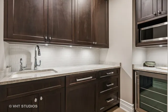 a view of a balcony with two chairs and a table