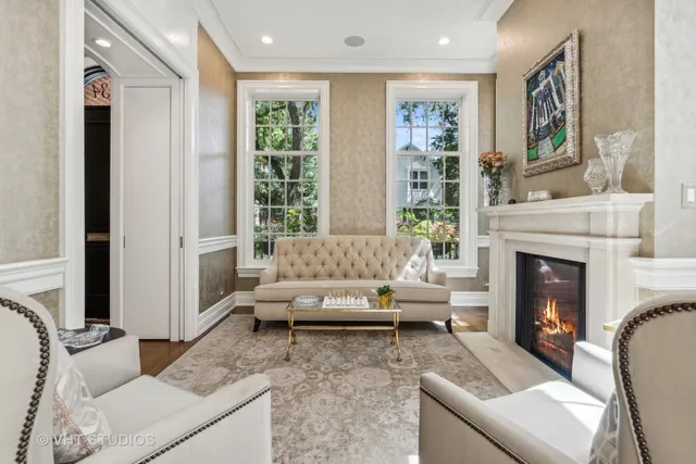 a living room with furniture and a fireplace