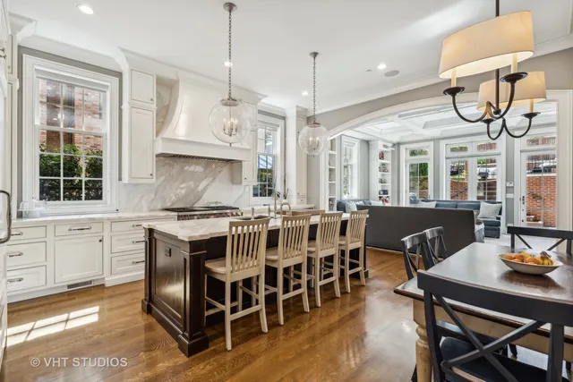 a large kitchen with a table and chairs