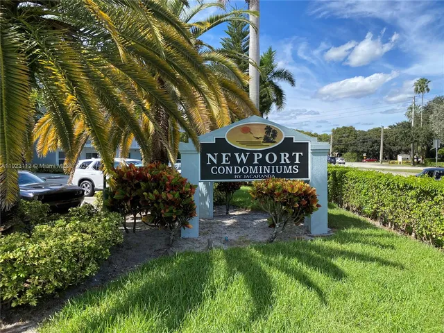 a view of outdoor space with sign board and garden