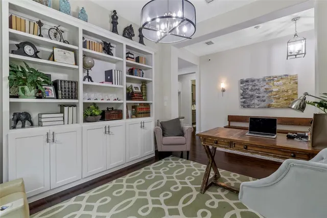 a view of work space with a piano and wooden floor