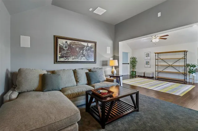 a living room with furniture and a table