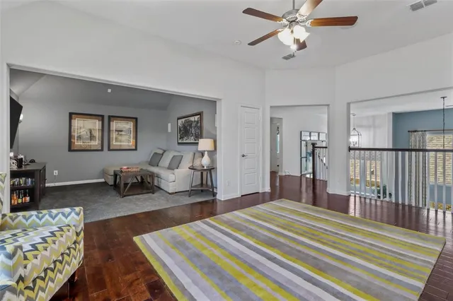 a bedroom with bed and a chandelier