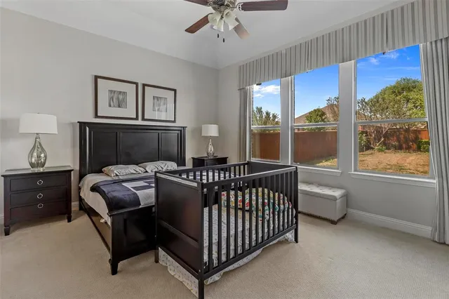 a bedroom with furniture and a window