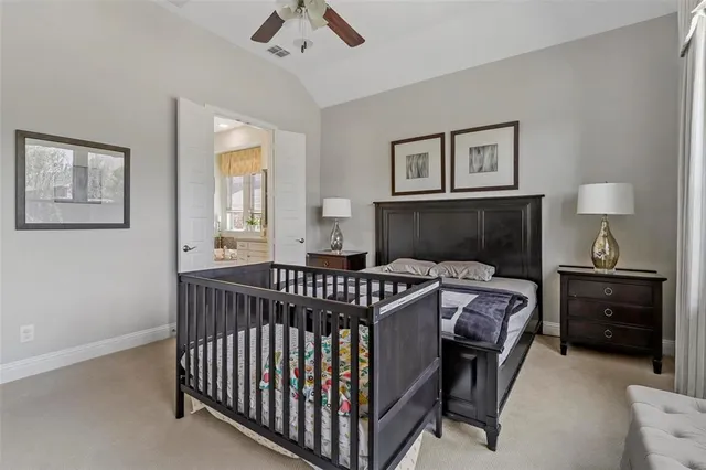 a bedroom with furniture and a window