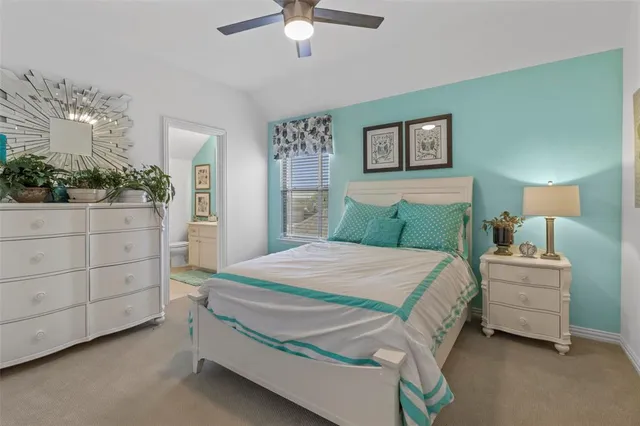 a bedroom with a bed and a cabinets