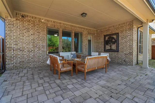 a view of a yard with a house in the background