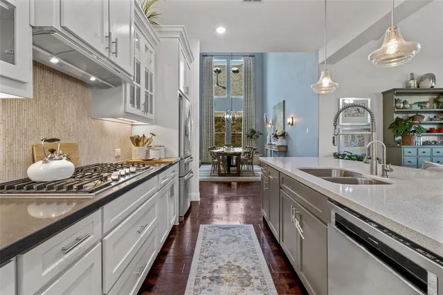 a large kitchen with a granite countertop double vanity
