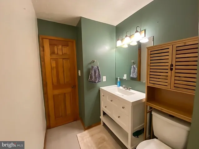 a bathroom with a sink a mirror and a shower