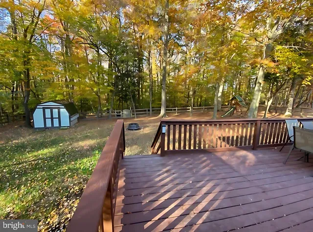 a view of deck with wooden floor and fence