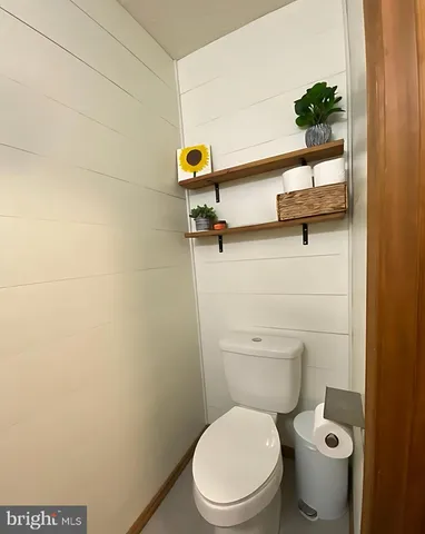 a bathroom with a toilet and a sink