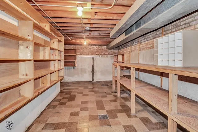 a utility room with a table and chairs